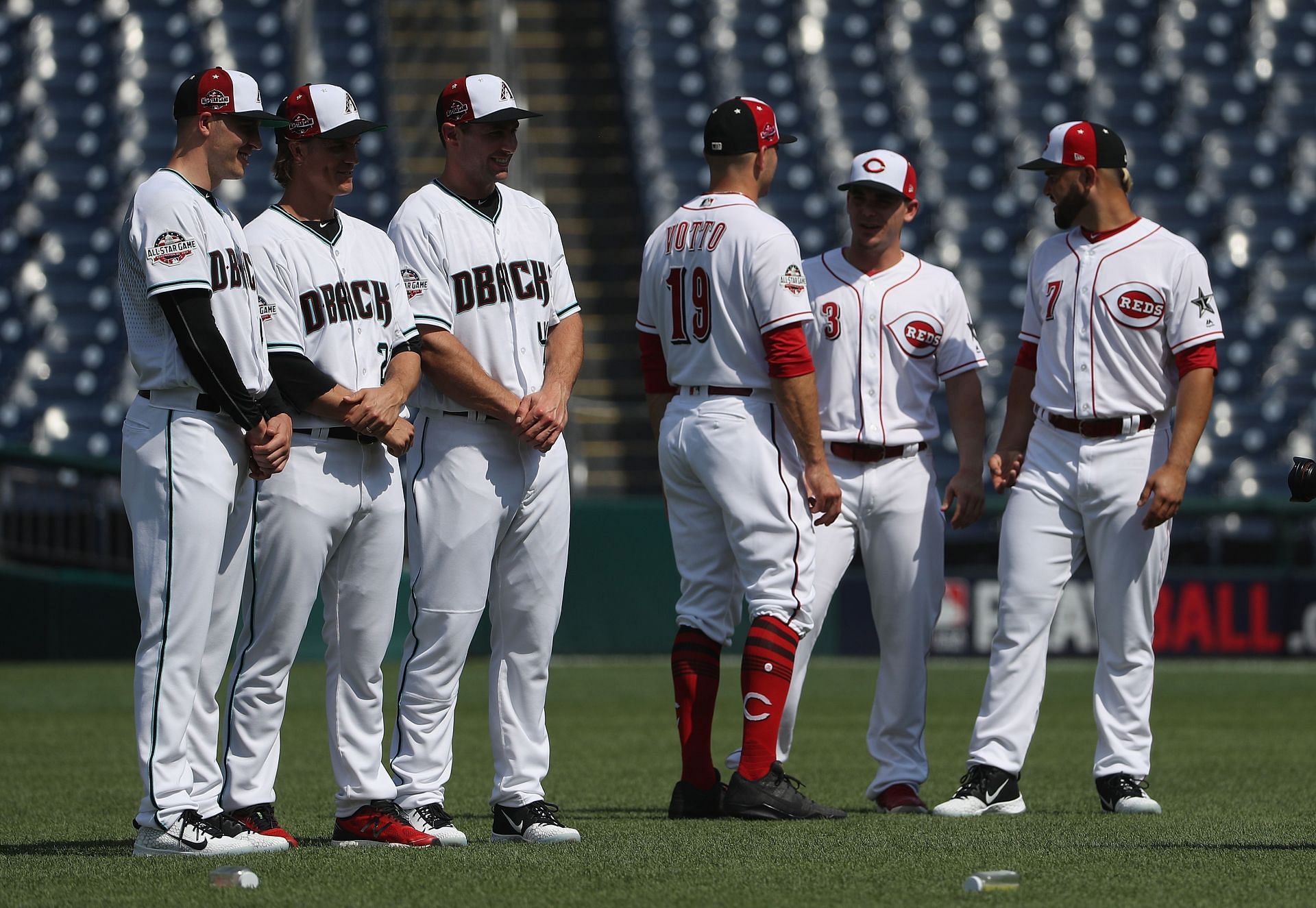 Patrick Corbin , Zack Greinke #21 and Paul Goldschmidt #44 of the Arizona Diamondbacks and National League All-Stars pose next to Joey Votto, Scooter Gennett #3 and Eugenio Suarez #7 of the Cincinnati Reds