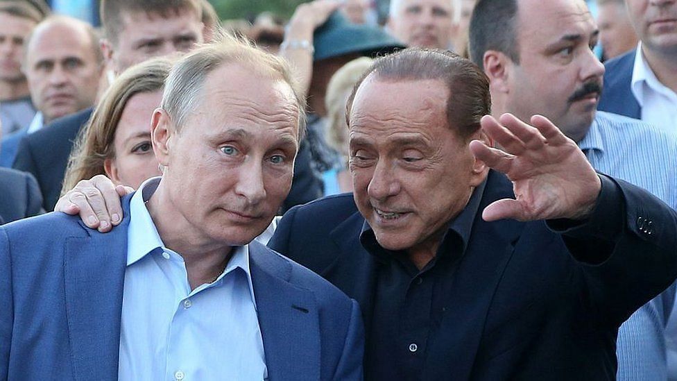 Vladimir Putin and Silvio Berlusconi (Image via Getty)
