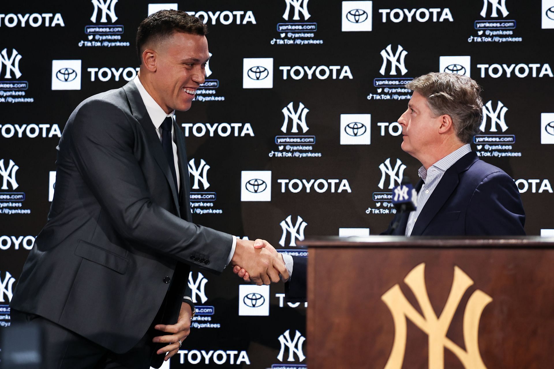Yankees principal owner Hal Steinbrenner greets Aaron Judge #99 of the New York Yankees during a press conference at Yankee Stadium on December 21, 2022