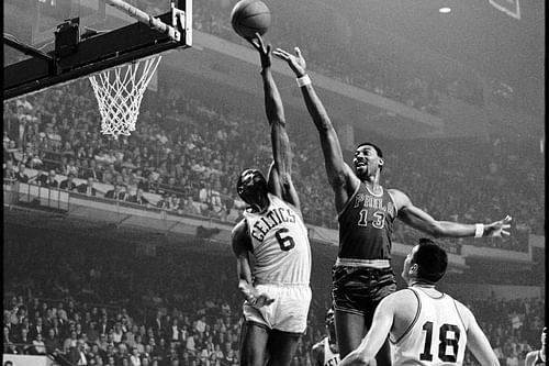 Bill Russell blocks Wilt Chamberlain.