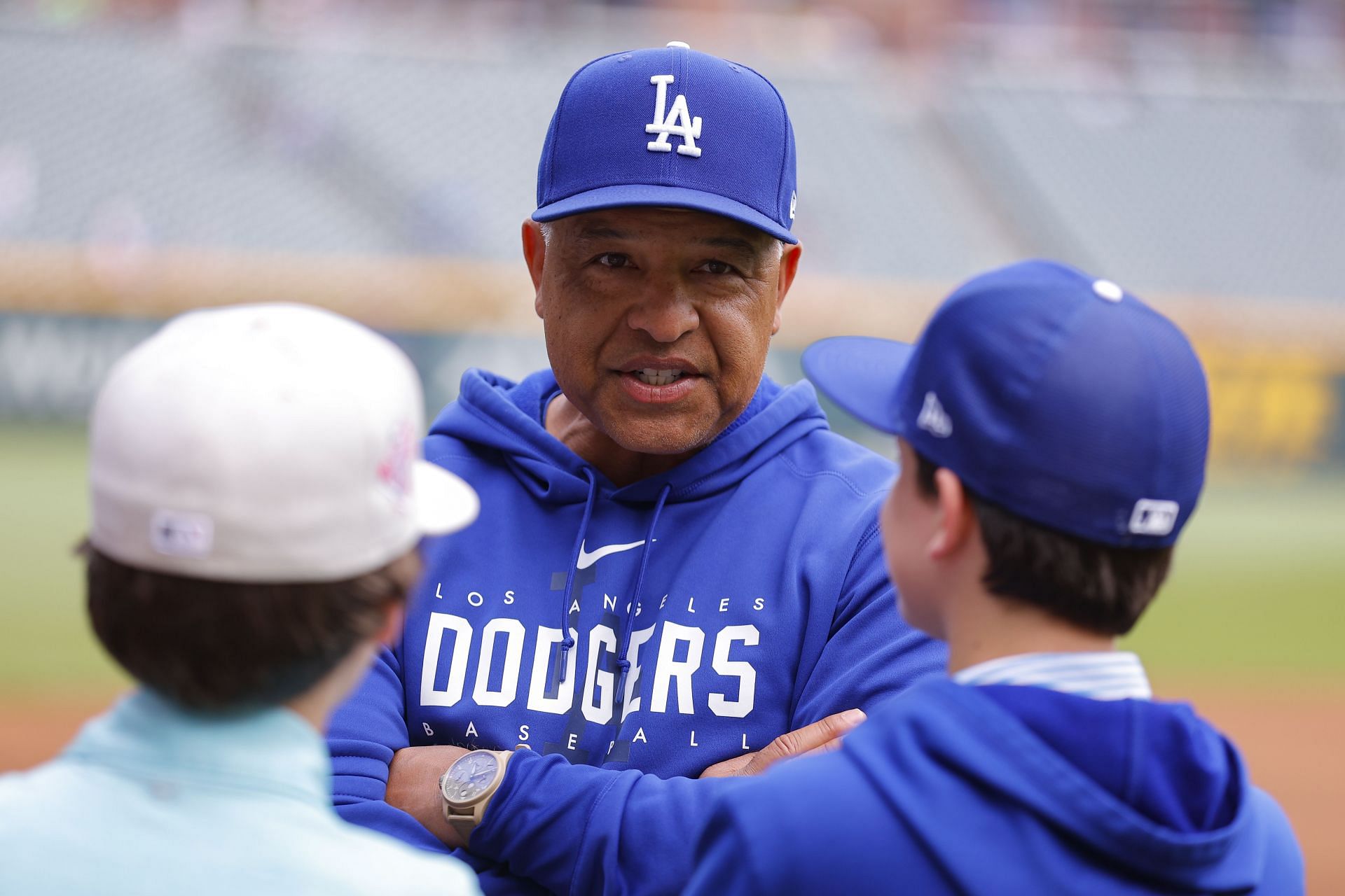 Manager Dave Roberts of the Los Angeles Dodgers talks to fans.
