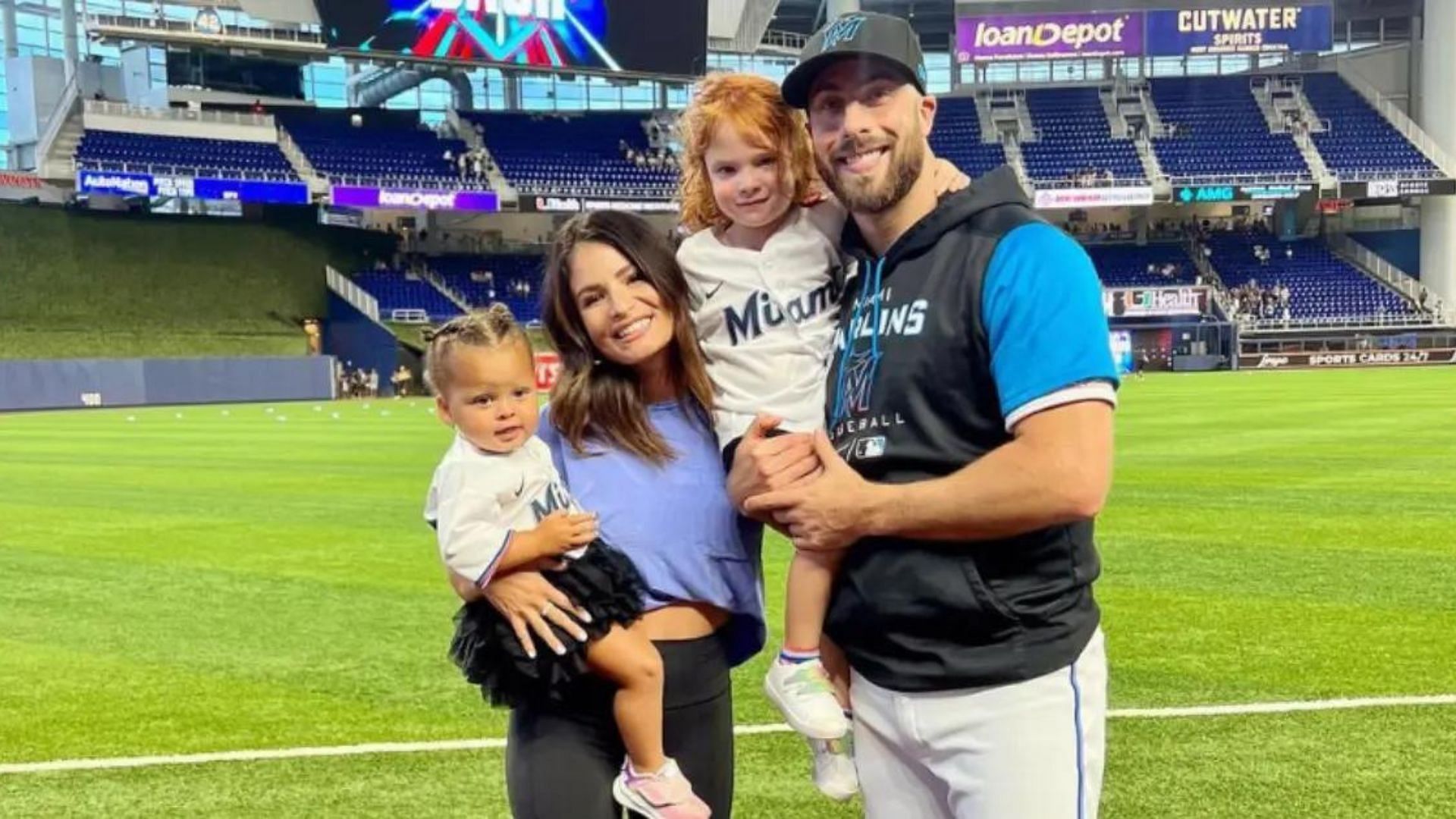 Anthony Bass and his wife with their two daughters