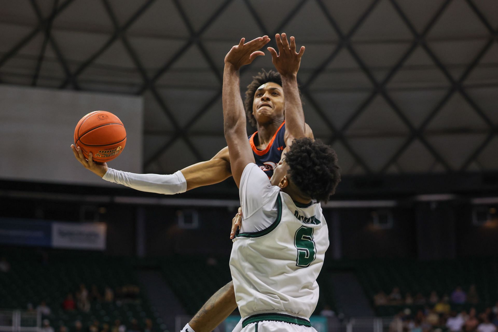 Maxwell Lewis #24 of the Pepperdine Waves attempts a scoop shot