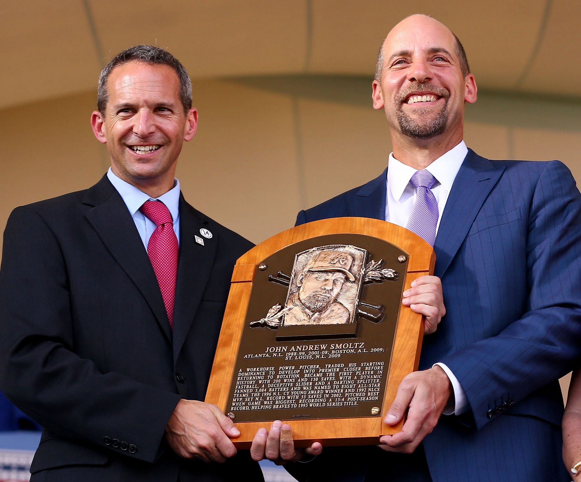 Hall of Fame President Jeff Idelson presents to John Smoltz his Hall of Fame Plaque during the Induction Ceremony at National Baseball Hall of Fame on July 26, 2015 in Cooperstown, New York. Smoltz, along with Pedro Martinez,Craig Biggio and Randy Johnson were inducted into the Baseball Hall of Fame. (Photo by Elsa/Getty Images)