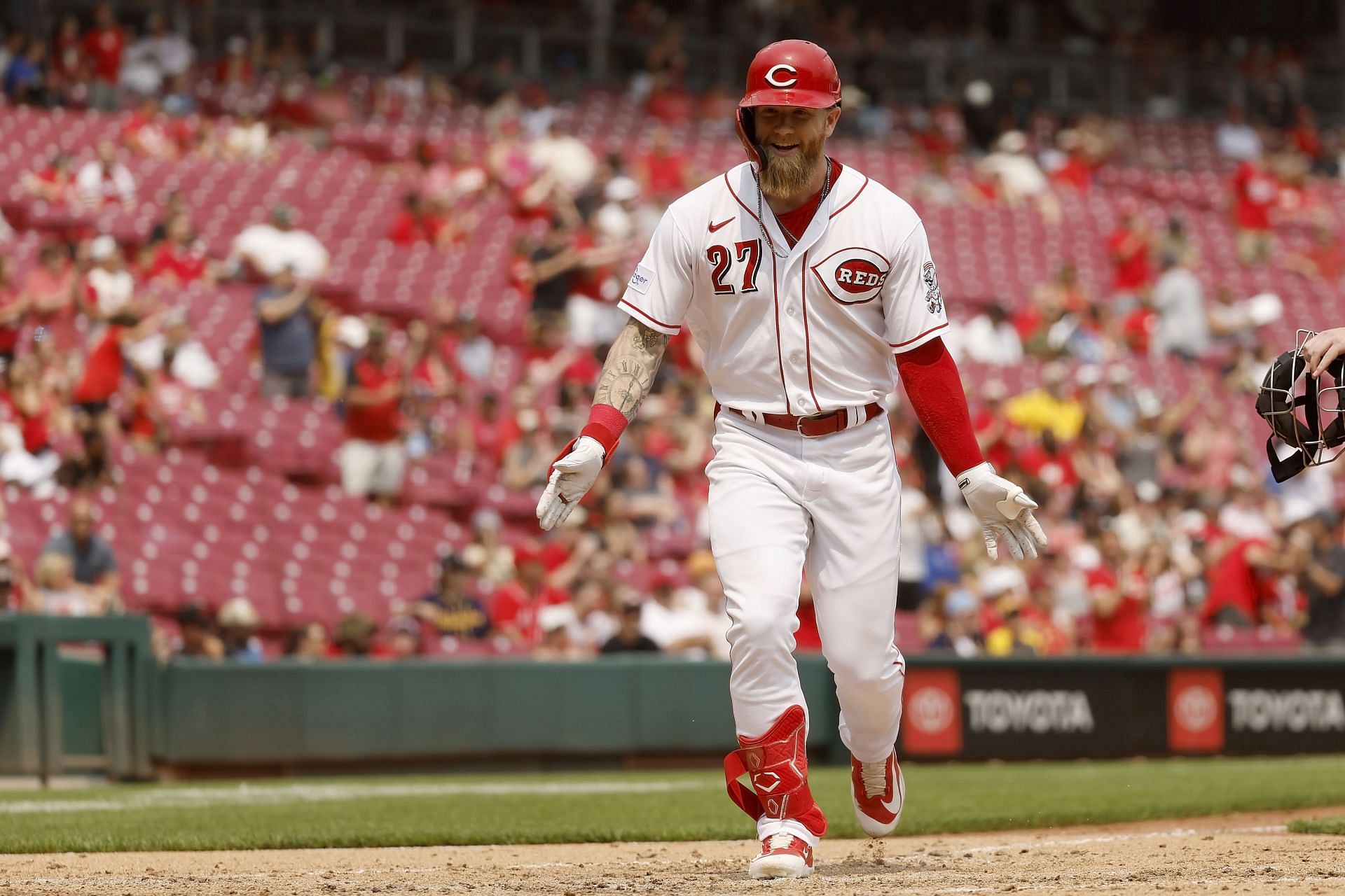 Jake Fraley #27 of the Cincinnati Reds reacts after hitting a solo home run during the seventh inning of a game against the Milwaukee Brewers