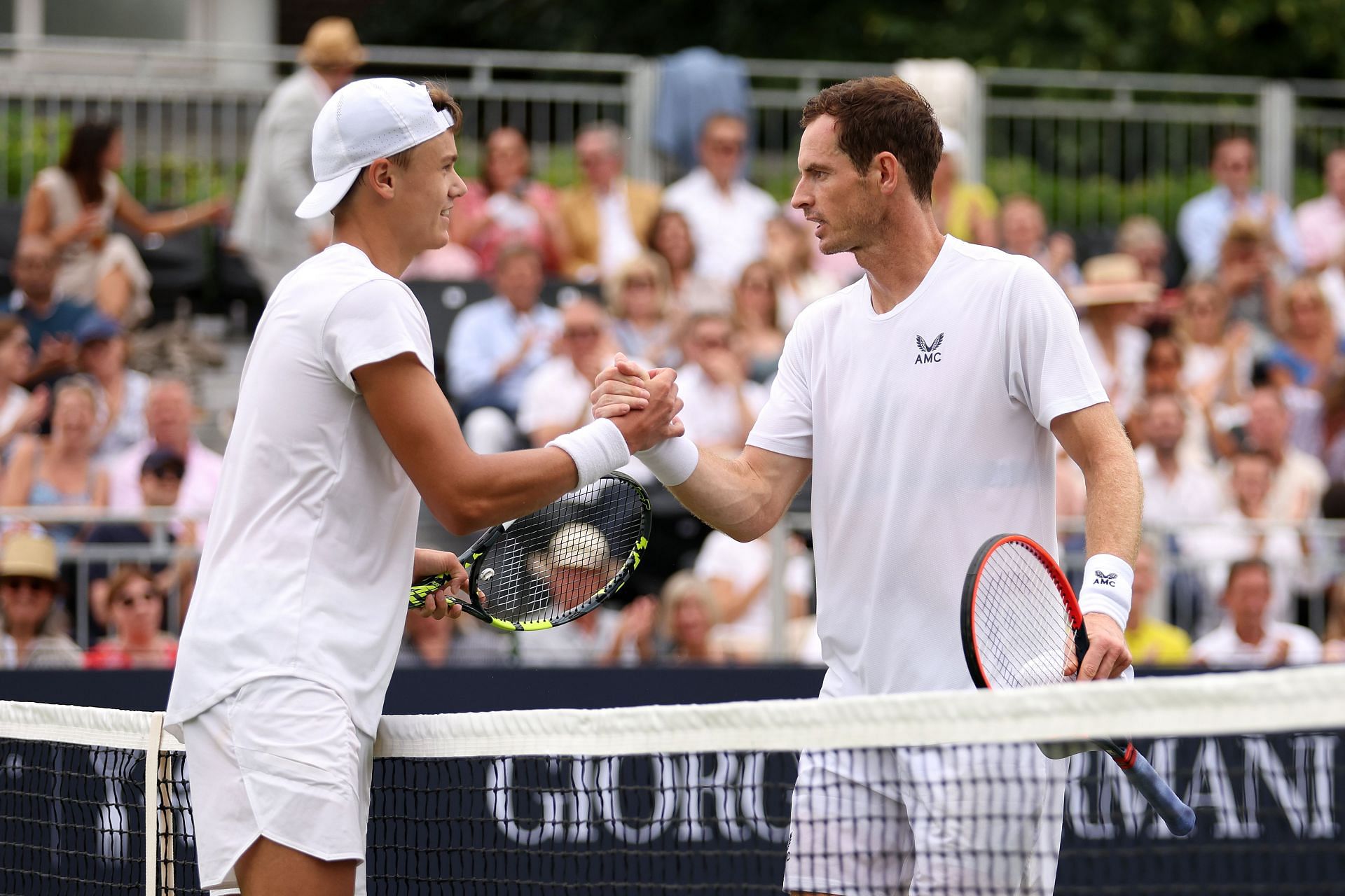 Holger Rune (L) and Andy Murray at the Hurlingham Tennis Classic on June 28