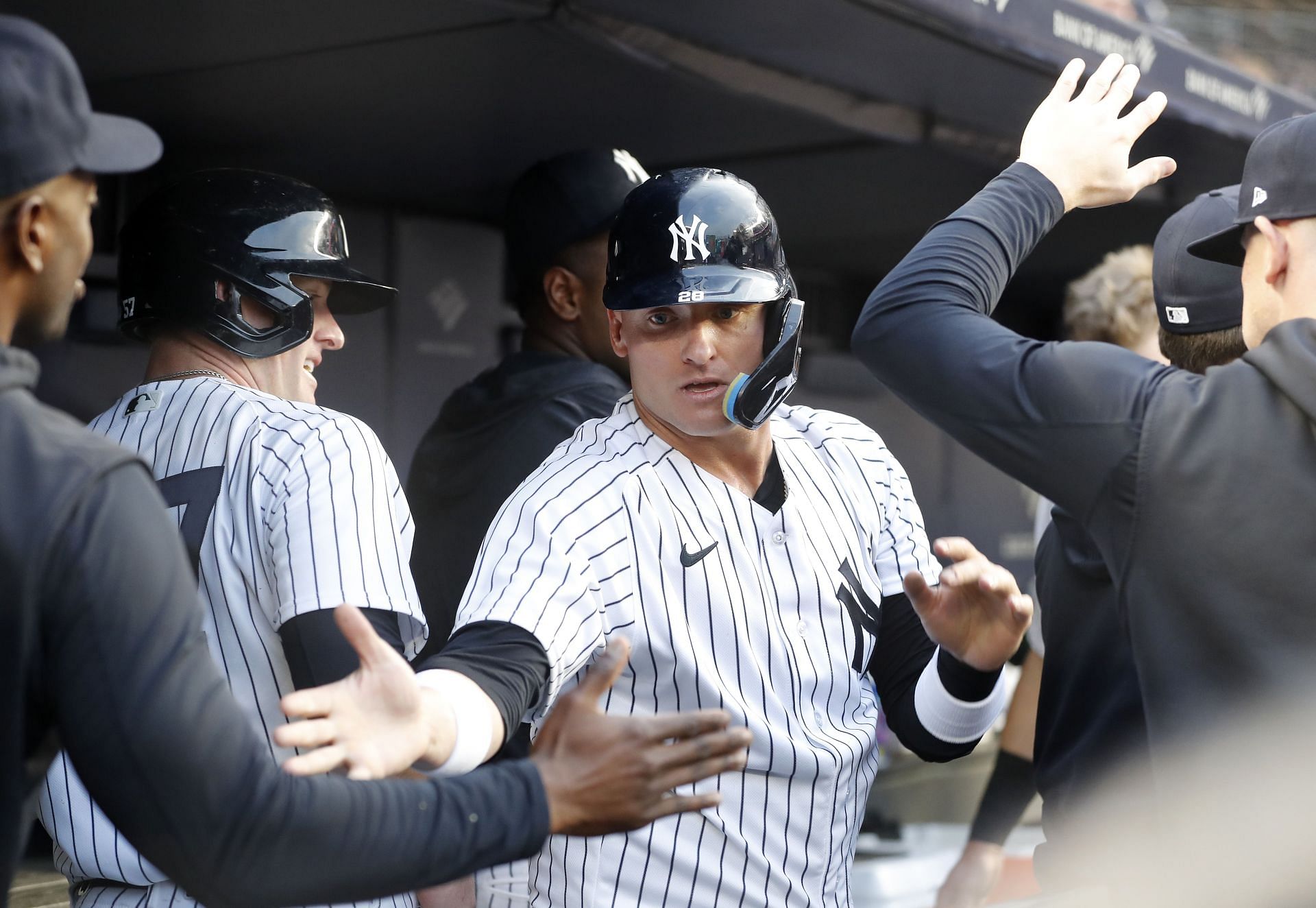 Josh Donaldson of the New York Yankees celebrates scoring a run in the dugout during the second inning against the Boston Red Sox at Yankee Stadium on June 11.