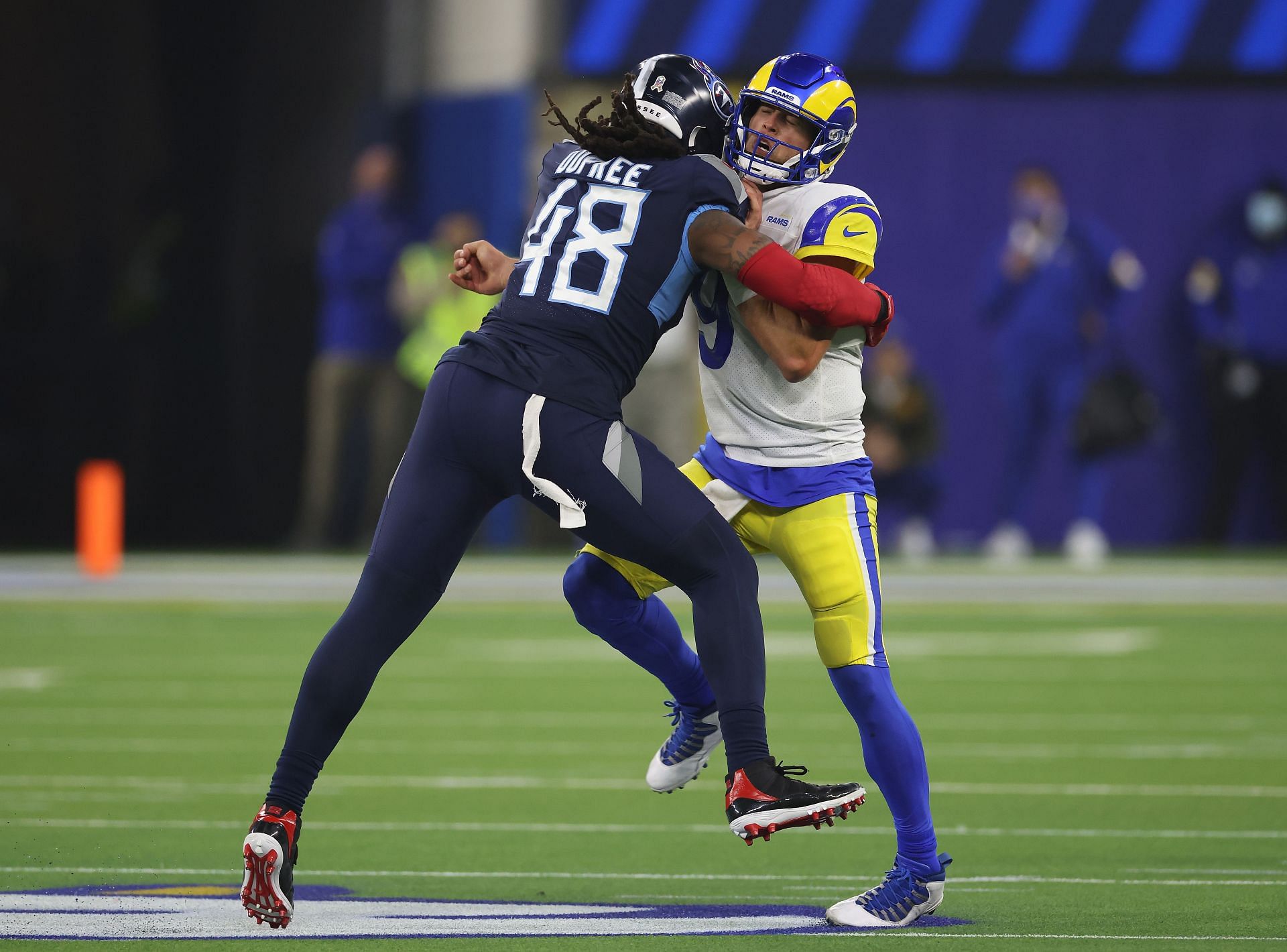 Matthew Stafford #9 of the Los Angeles Rams reacts as he is pressured by Bud Dupree #48 of the Tennessee Titans