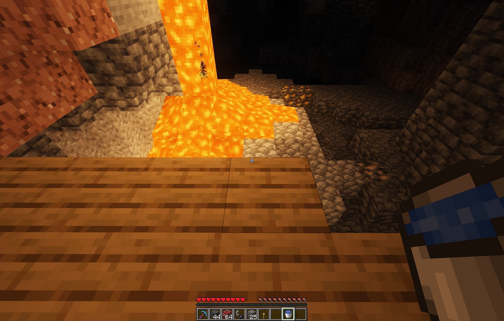 Always carry a water bucket for safety (Image via Mojang)