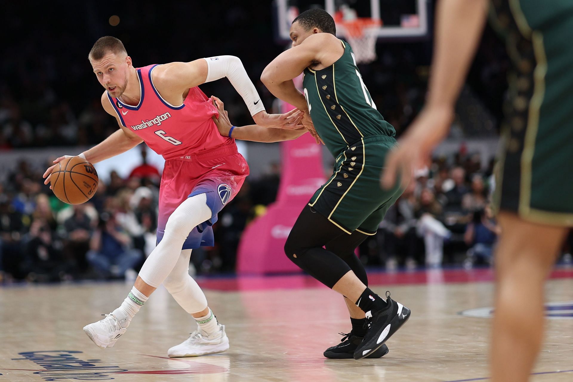 Former Washington Wizards big man Kristaps Porzingis (left)