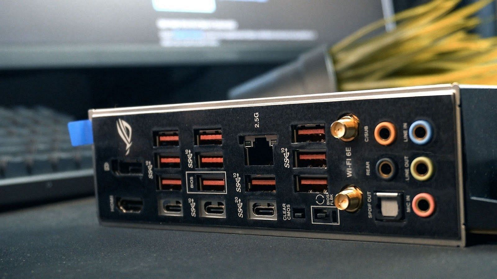 The plush rear I/O cover of the ASUS motherboard (Image via Sportskeeda)