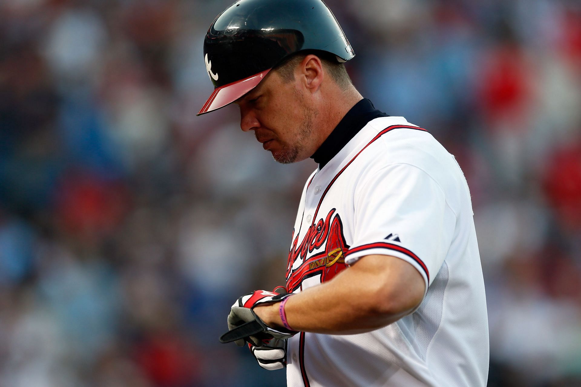 Chipper Jones #10 of the Atlanta Braves walks back to the dugout after flying out in the sixth inning against the St. Louis Cardinals during the National League Wild Card playoff game at Turner Field on October 5, 2012 in Atlanta, Georgia. (Photo by Kevin C. Cox/Getty Images)