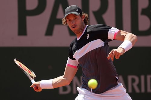 Nicolas Jarry attempts to strike the ball at the 2023 French Open