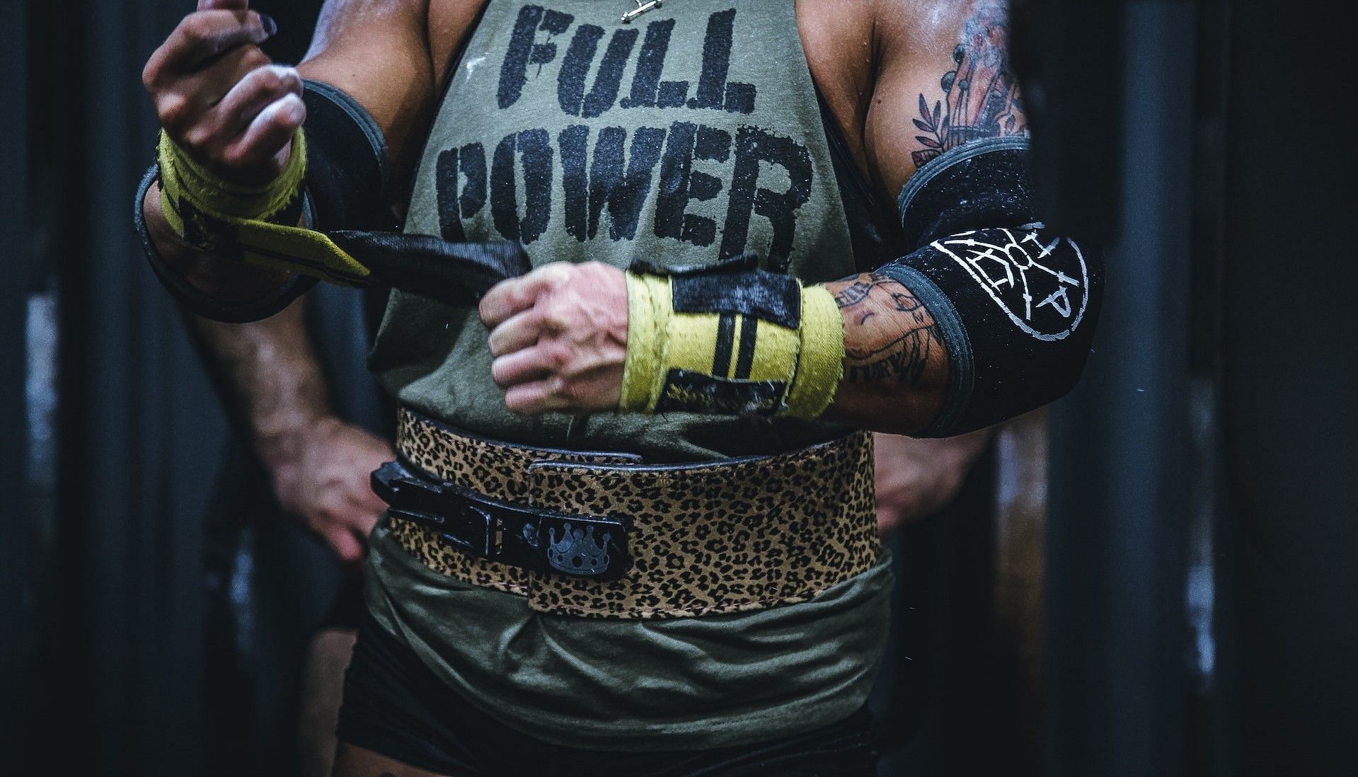 Using lifting belts (Photo by Alora Griffiths on Unsplash)