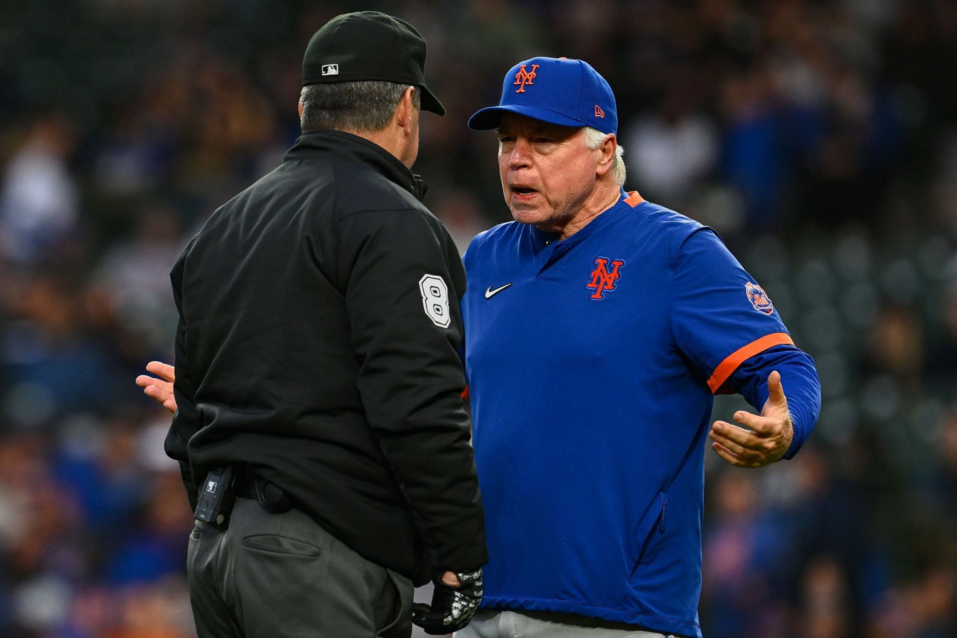 Manager Buck Showalter of the New York Mets talks with umpire Rob Drake against the Chicago Cubs at Wrigley Field