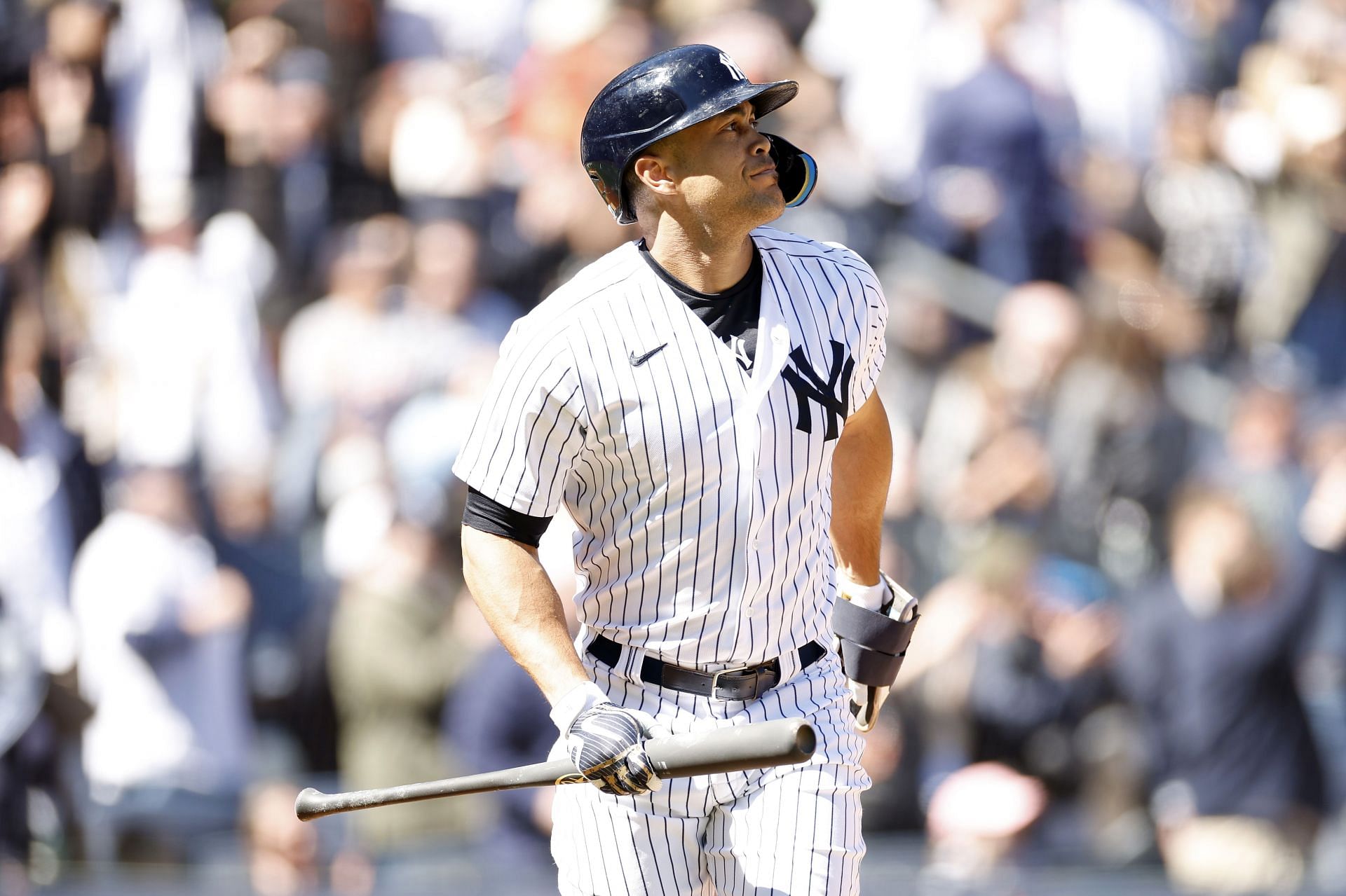 Giancarlo Stanton of the New York Yankees reacts after hitting a home run at Yankee Stadium