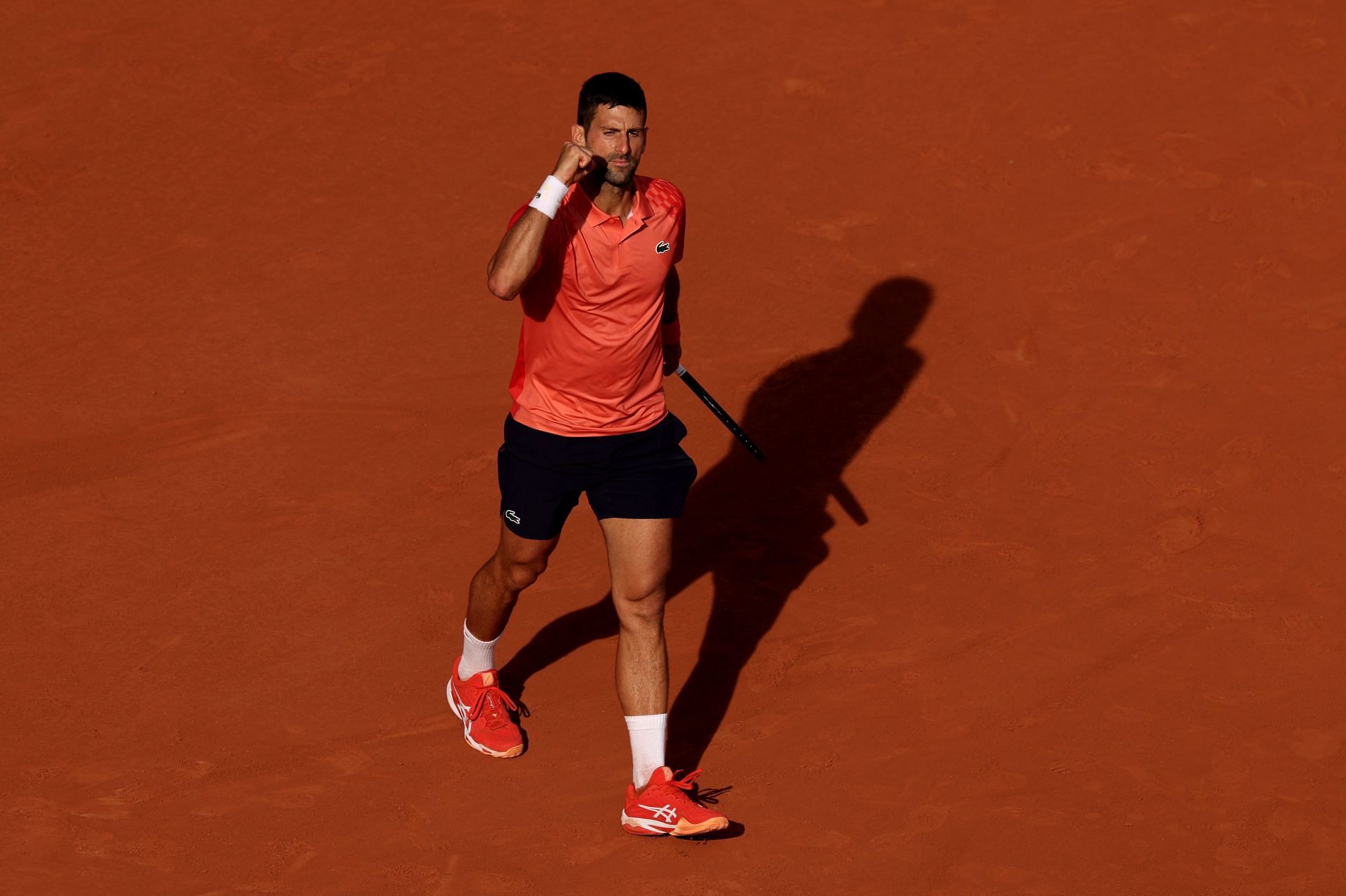 Novak Djokovic celebrates winning match point on Friday against Alcaraz.
