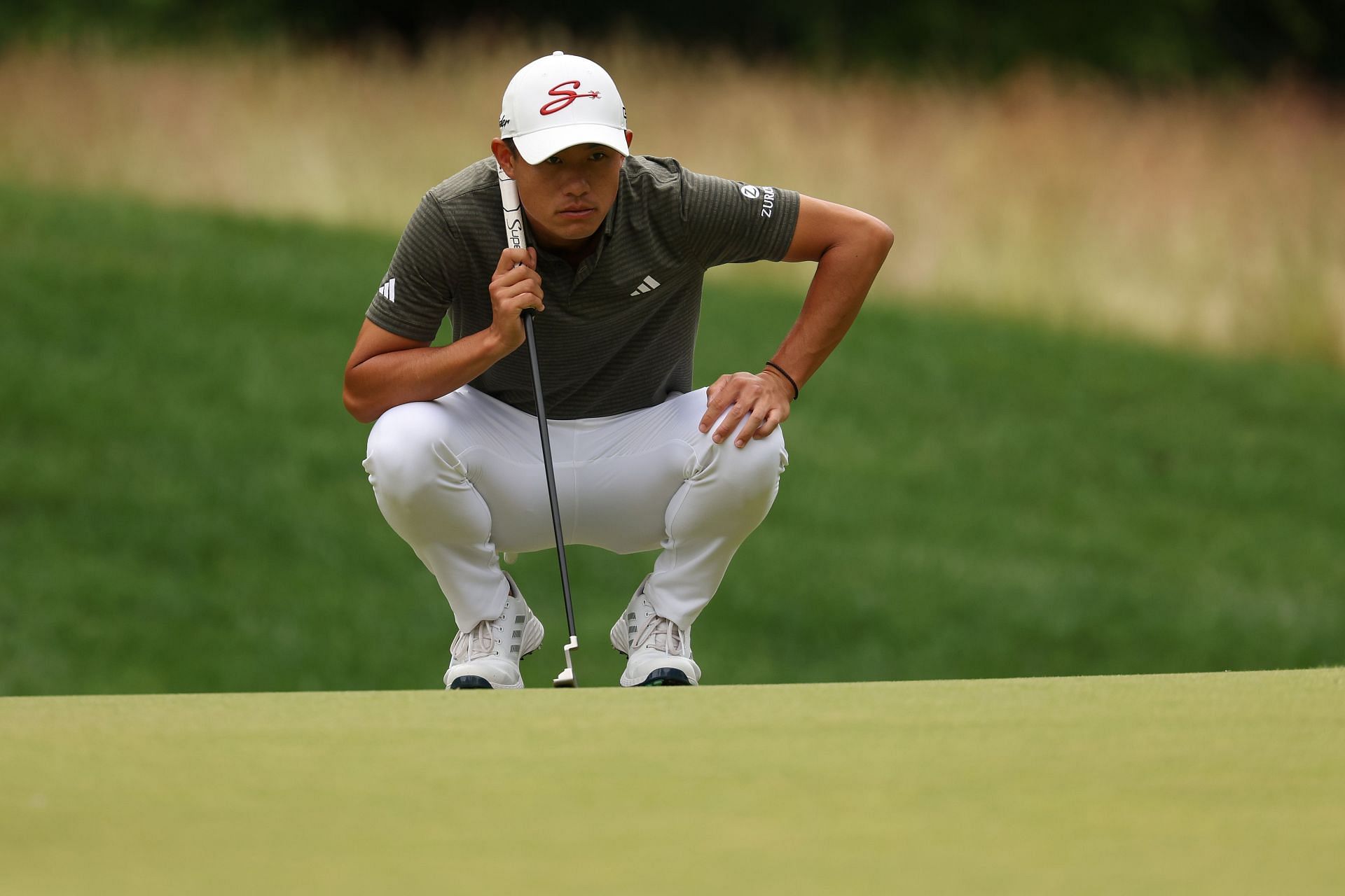 Collin Morikawa lines up his put during the Travelers Championship, Round Two