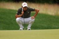 Collin Morikawa lines up his put during the Travelers Championship, Round Two