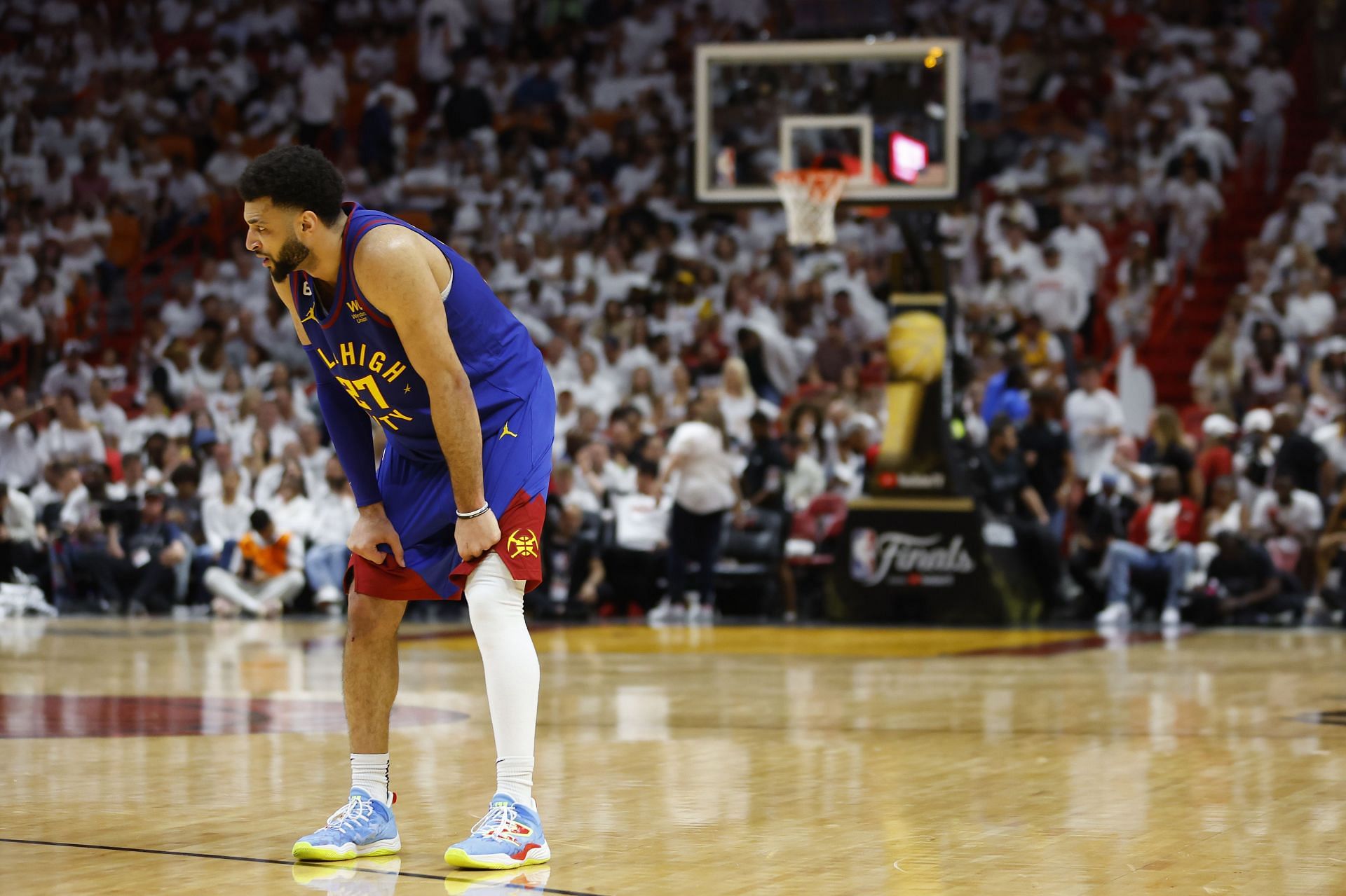 Jamal Murray skins his hand diving for a ball during Game 3