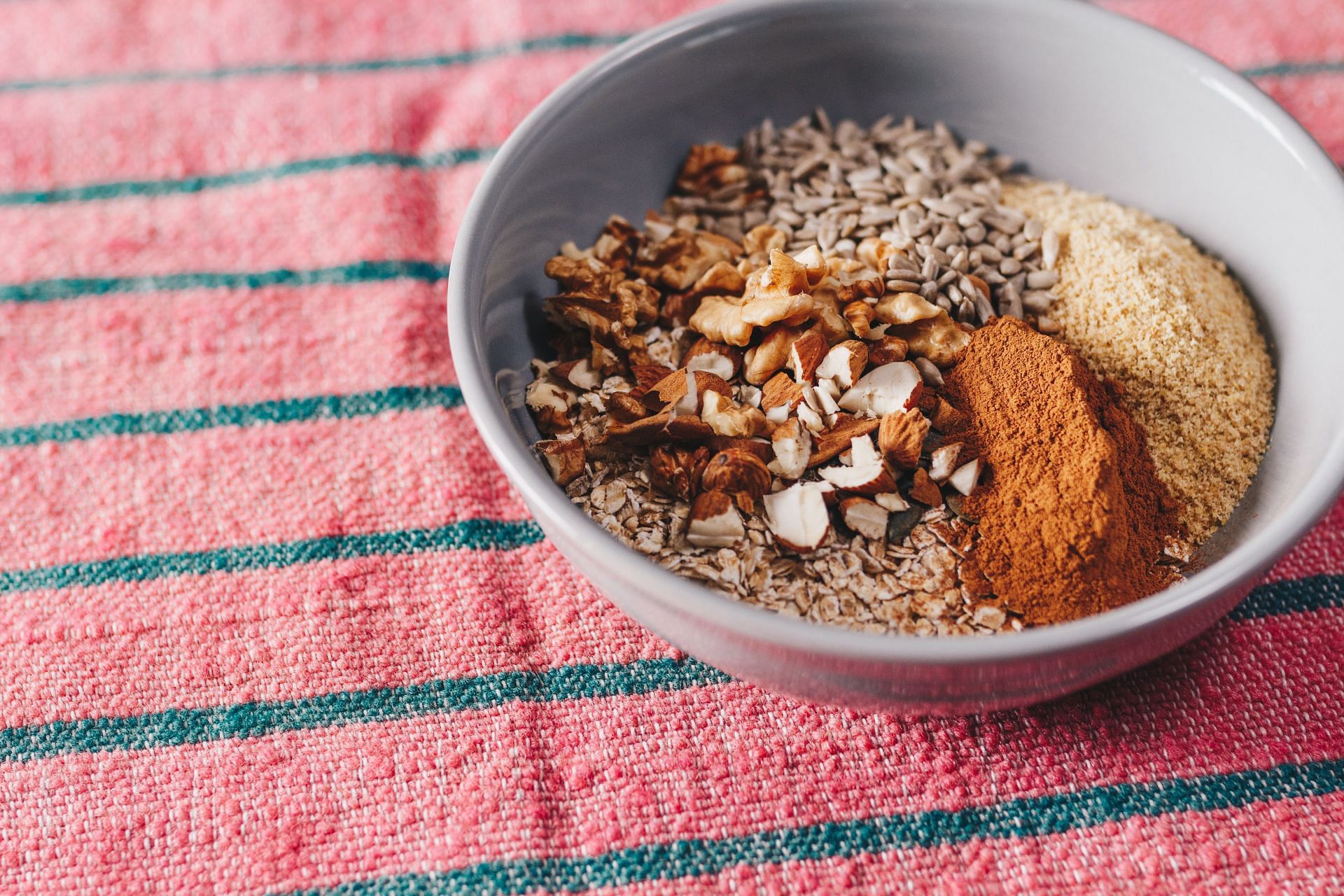 A bowl of nuts and seeds is rich in vitamin K (Image via Pexels)