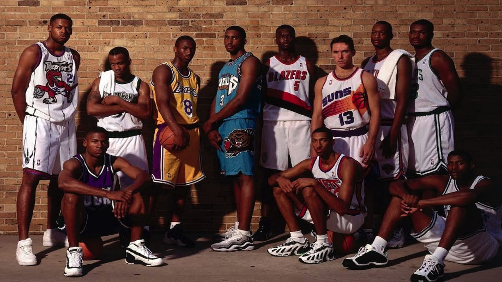 The 1996 NBA Draft class in their team uniforms