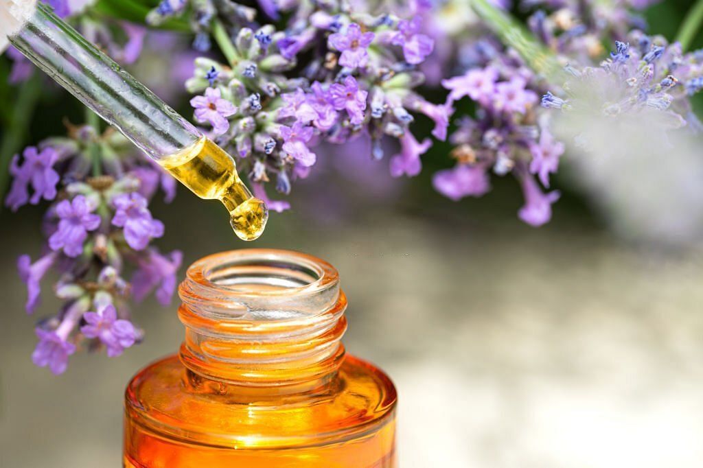 Lavender flowers and Beauty Facial Serum or Smooth and Glow Facial Natural Essential Oil(Image via Getty Images)