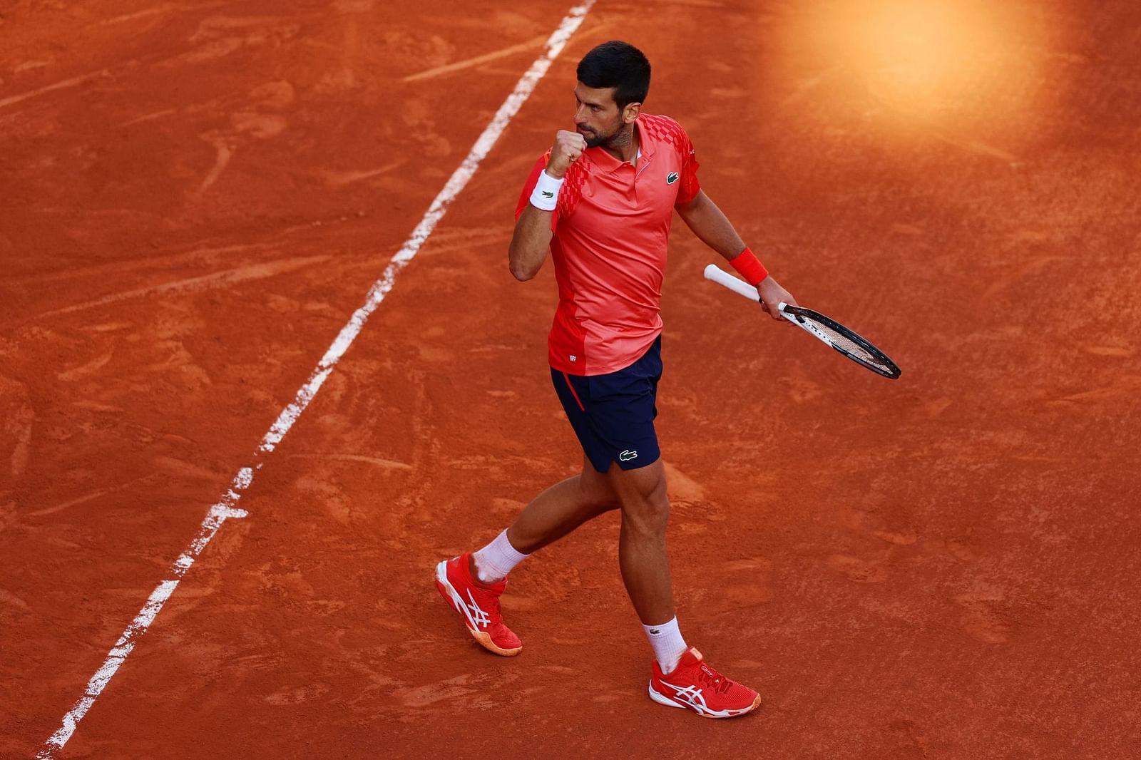 Why does Novak Djokovic speak in French at Roland Garros?