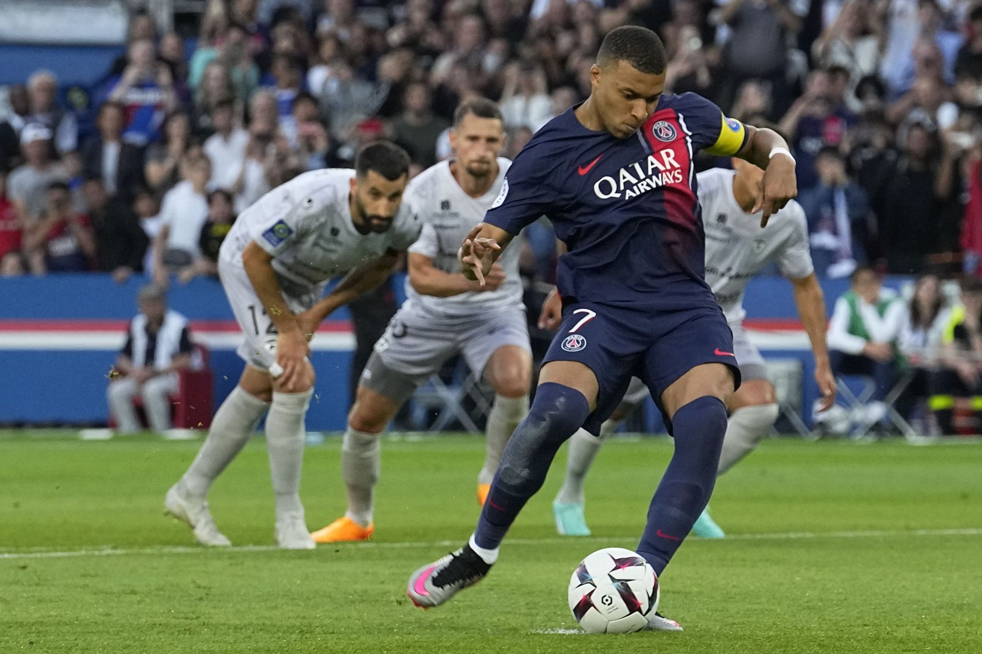 Kylian Mbappe scores a penalty kick for Paris Saint-Germain against Clermont Foot