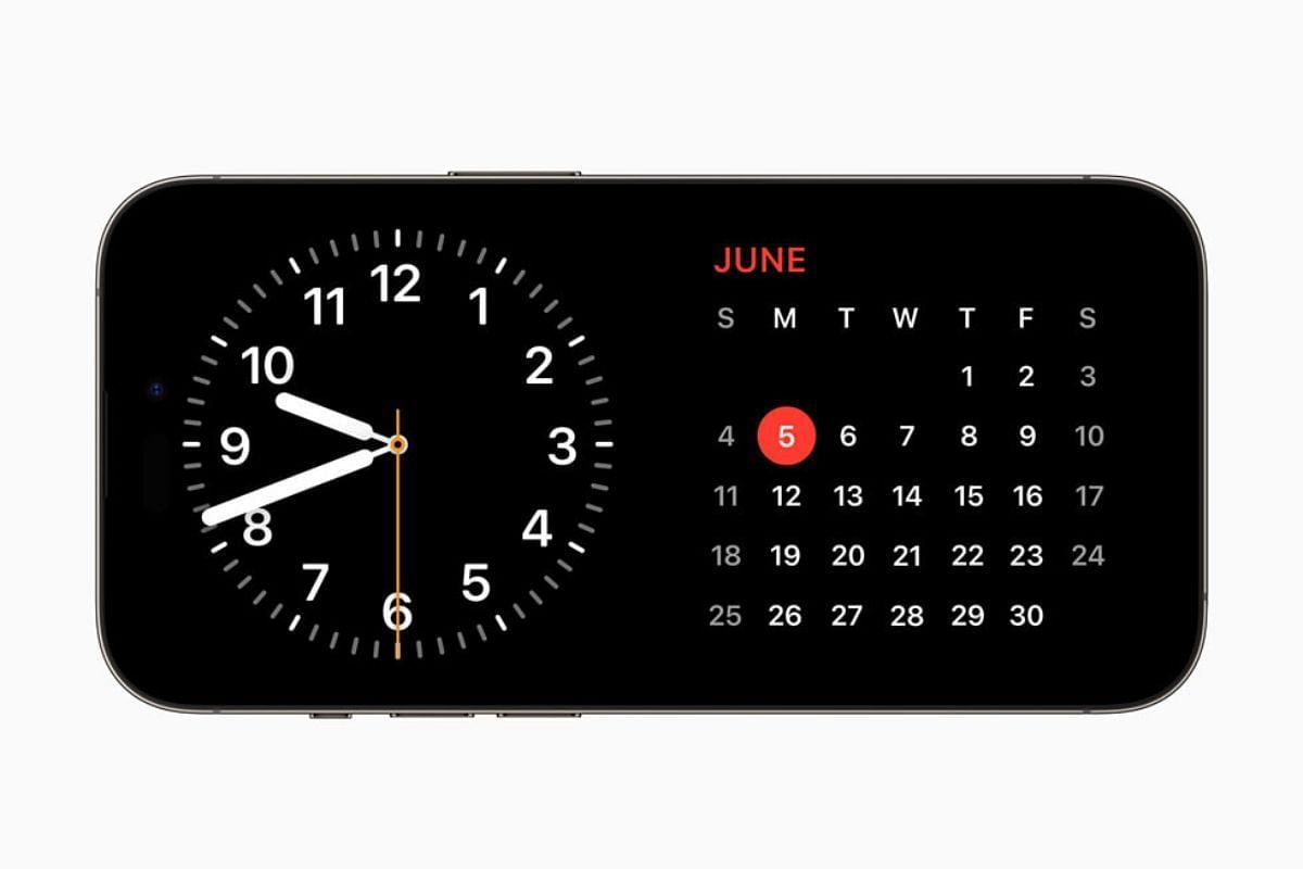 iOS 17 users can customize StandBy mode in the clock, photos, and widget views (Image via Apple)