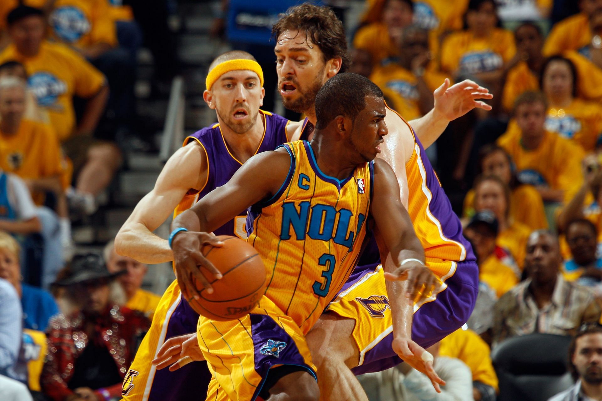 Chris Paul #3 of the New Orleans Hornets drives the ball around Pau Gasol #16 of the Los Angeles Lakers