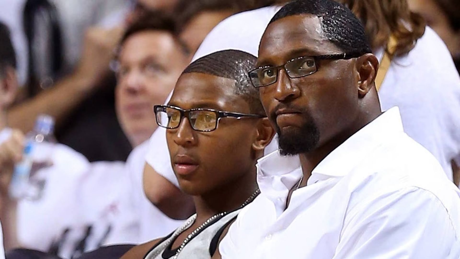 Former NFL player Ray Lewis (right) and his son, Ray Lewis III (left) watch Game Two of the Eastern Conference Finals between the Indiana Pacers and the Miami Heat on May 24, 2013. (Image via Mike Ehrmann of Getty Images)