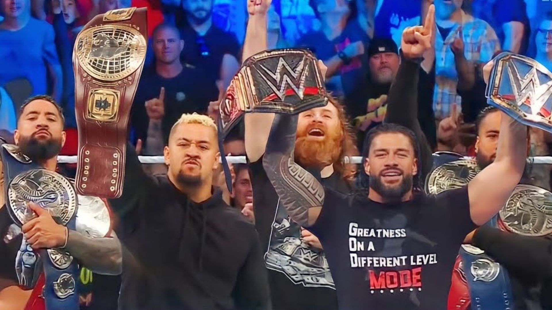 The Bloodline with their titles on WWE SmackDown.