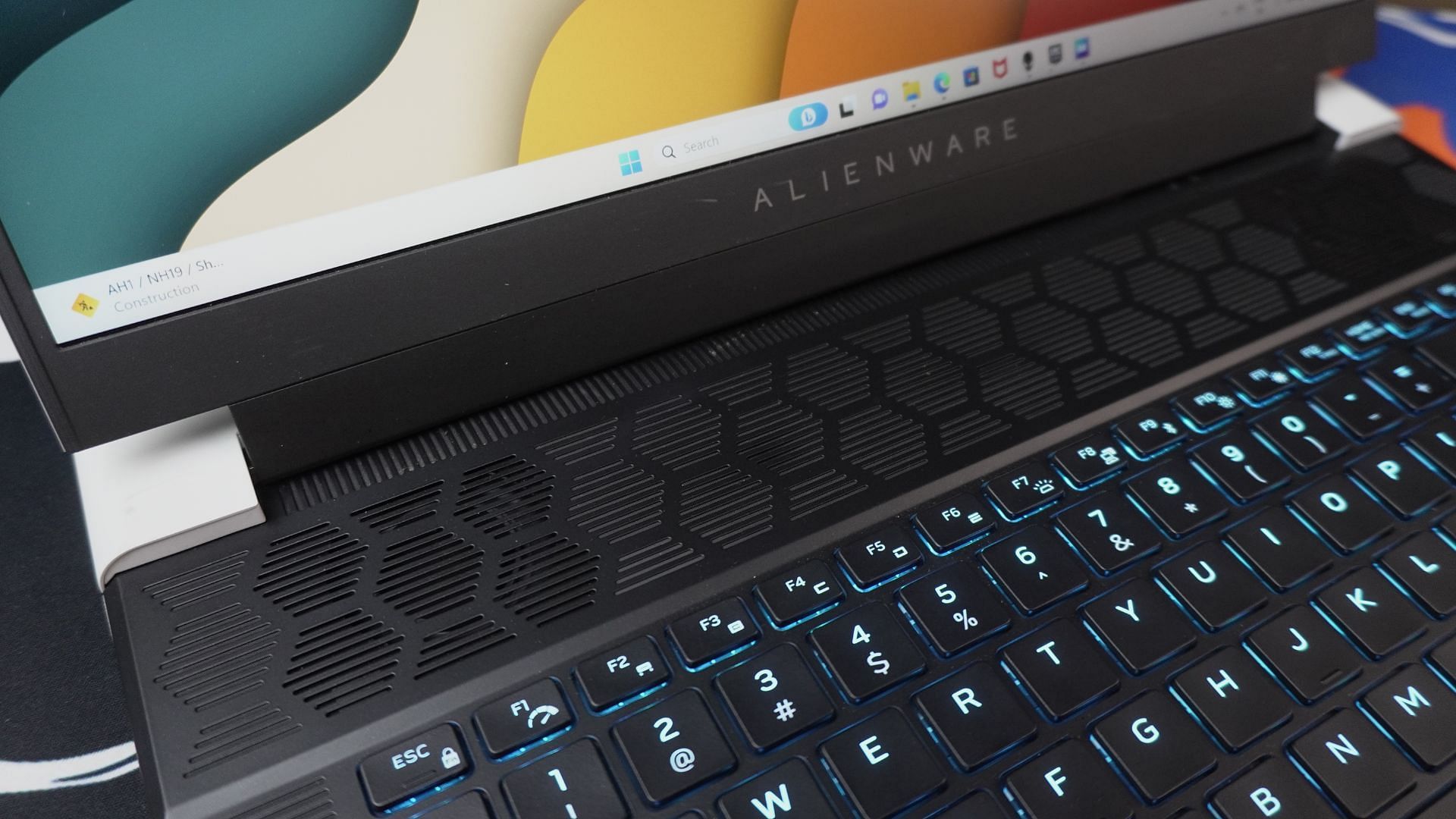 The air intake grille on the top of the Alienware X16 laptop (Image via Sportskeeda)