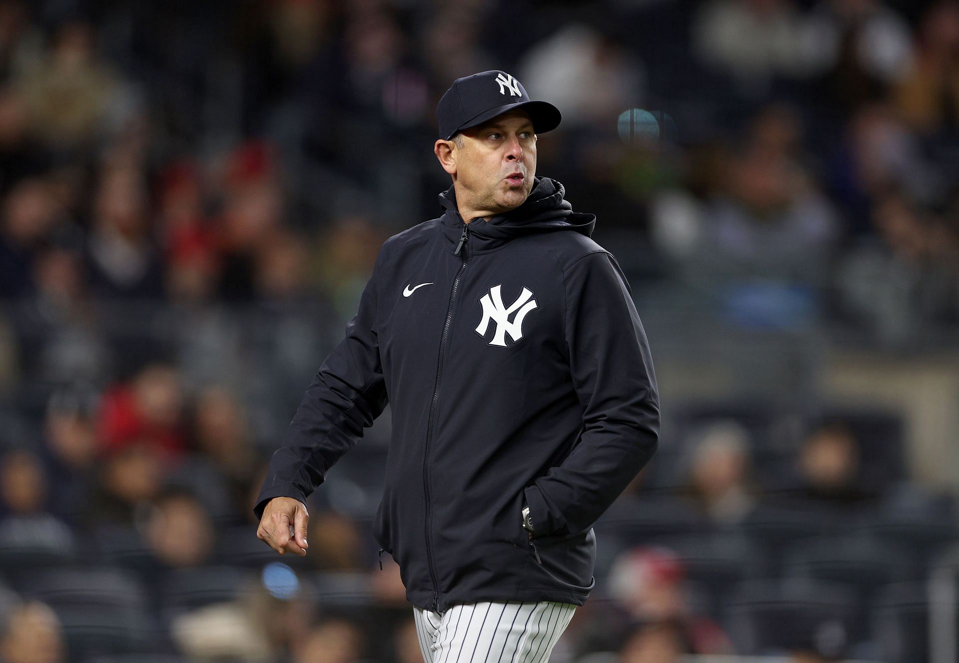 Manager Aaron Boone of the New York Yankees walks back to the dugout against the Los Angeles Angels at Yankee Stadium