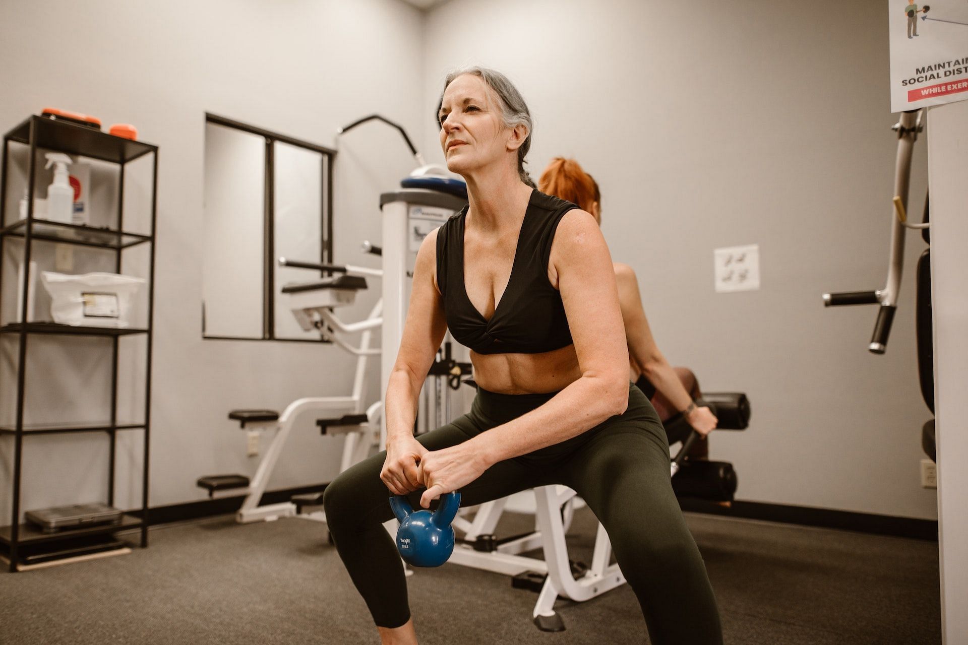 Weighted squats (Photo via Pexels/RDNE Stock project)