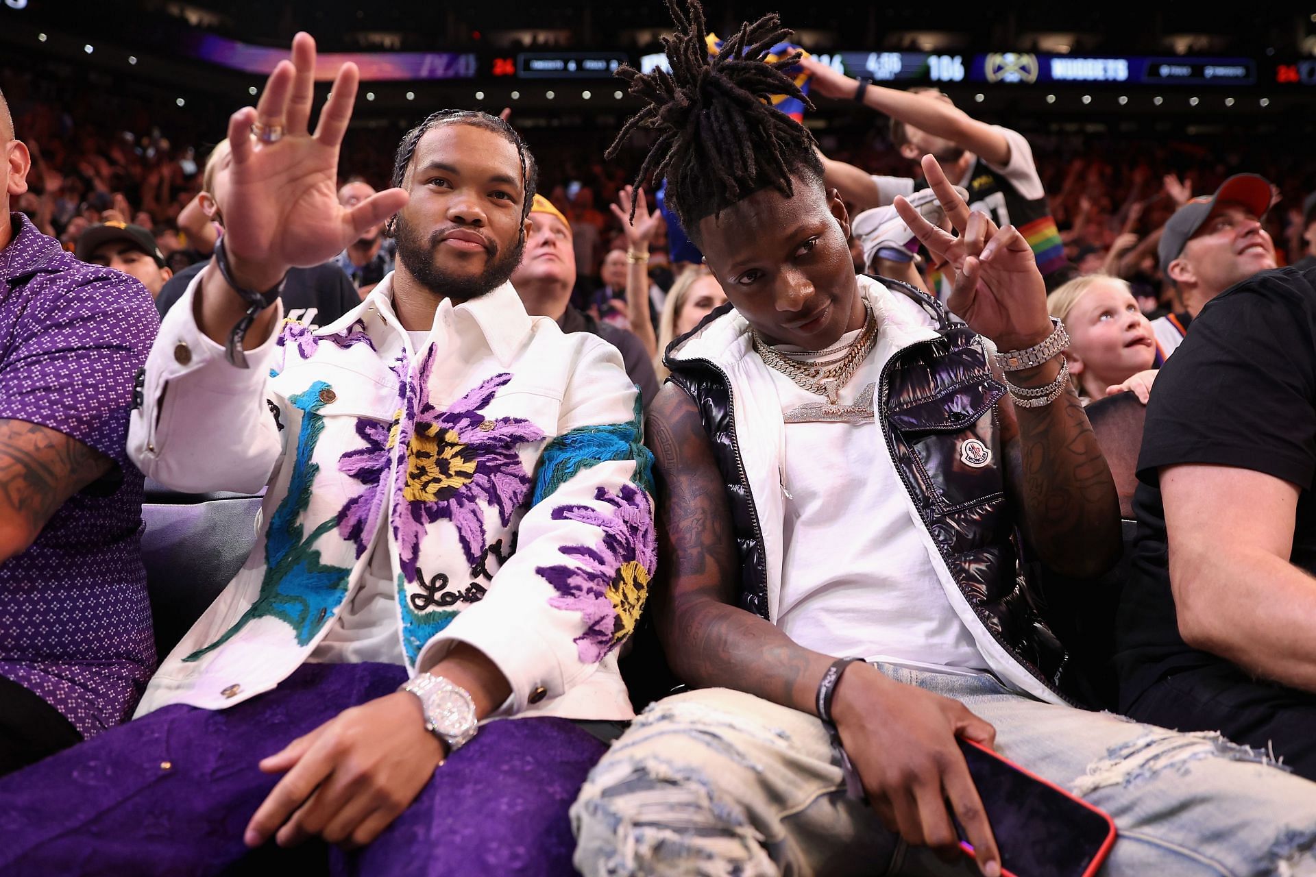 NFL athletes Kyler Murray and Marquise Brown of the Arizona Cardinals attend Game Four of the NBA Western Conference Semifinals between the Phoenix Suns and the Denver Nuggets at Footprint Center on May 07, 2023, in Phoenix, Arizona.