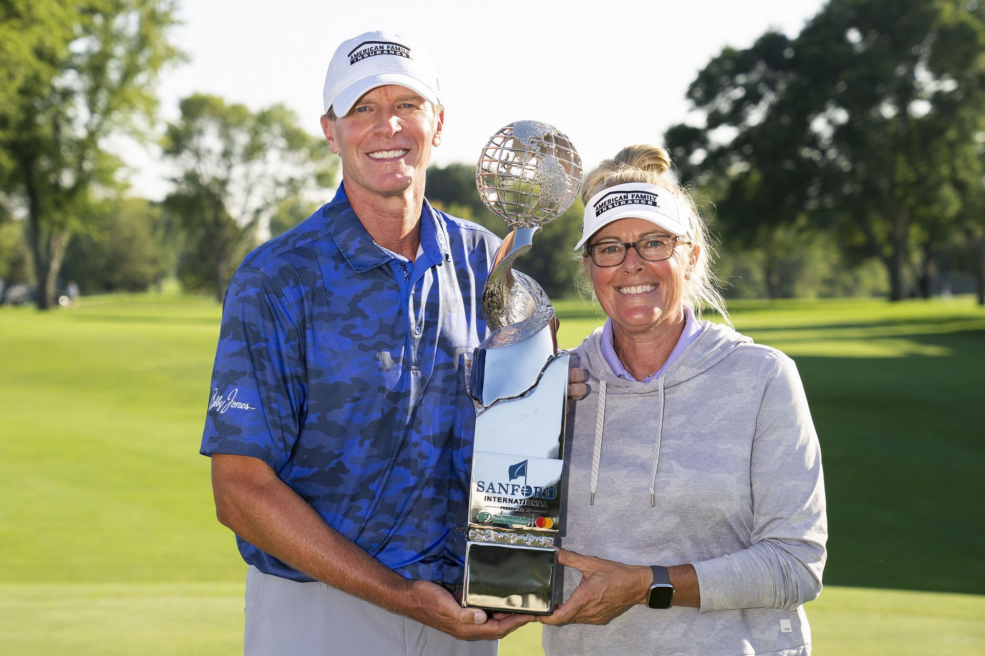 Steve and his wife Nicki Stricker with Sanford International Trophy (via Getty Images)