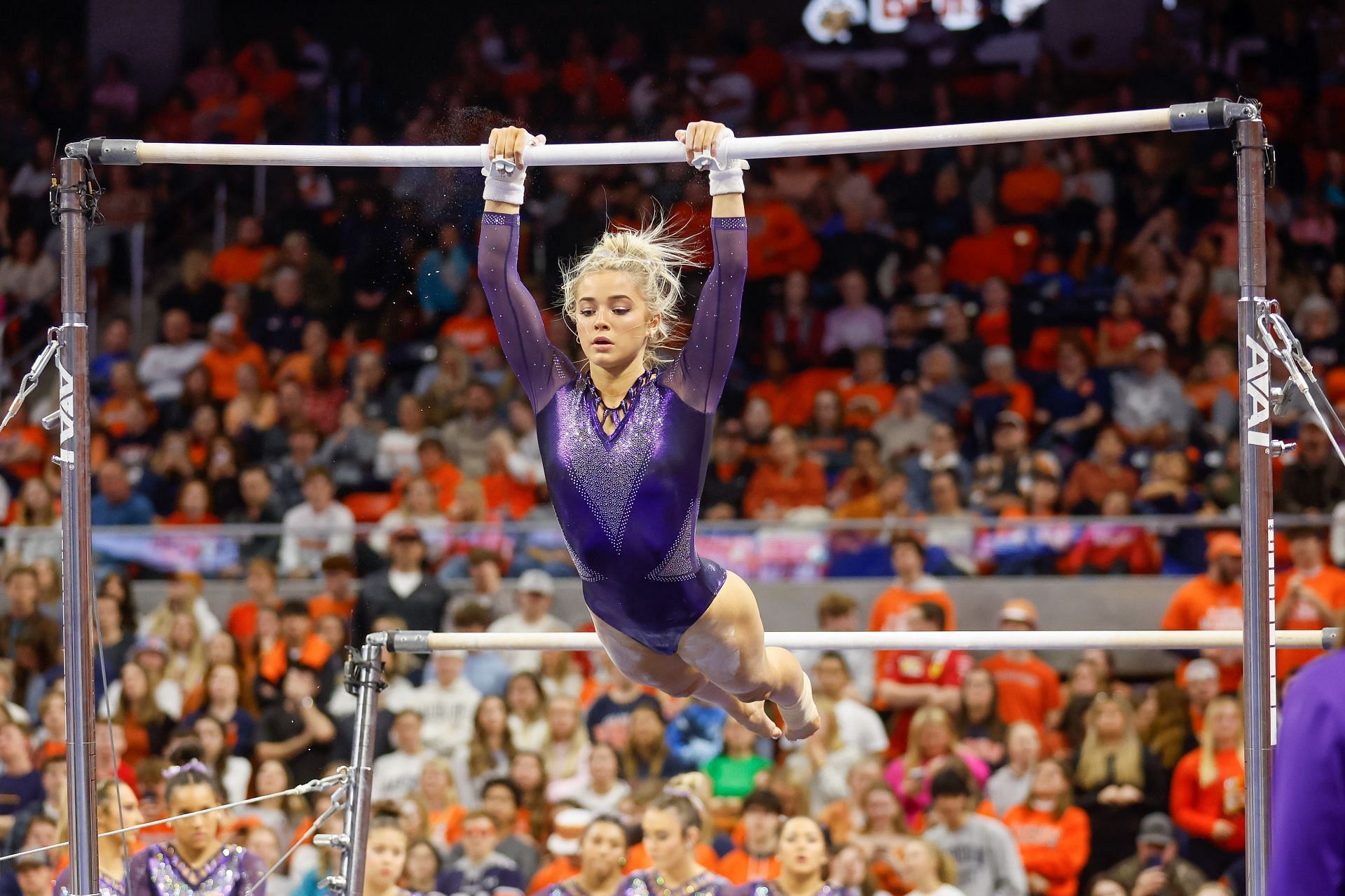 Olivia Dunne of LSU warms up on the uneven bars during a gymnastics meet