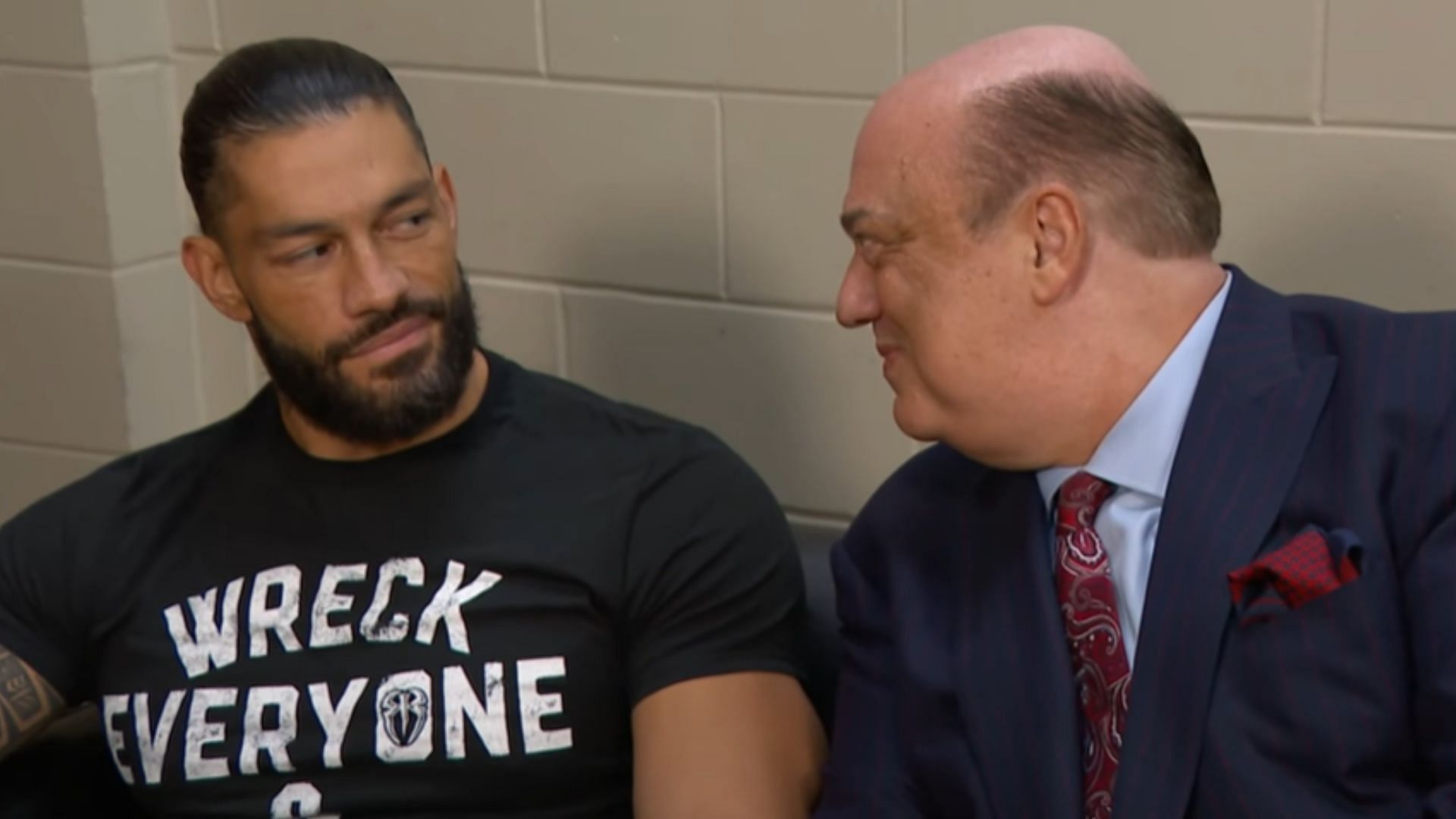 Roman Reigns (left) and Paul Heyman (right)