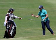 Ashleigh Buhai switches clubs with her caddie Tanya Paterson during the final round of the Palos Verdes Championship 2022