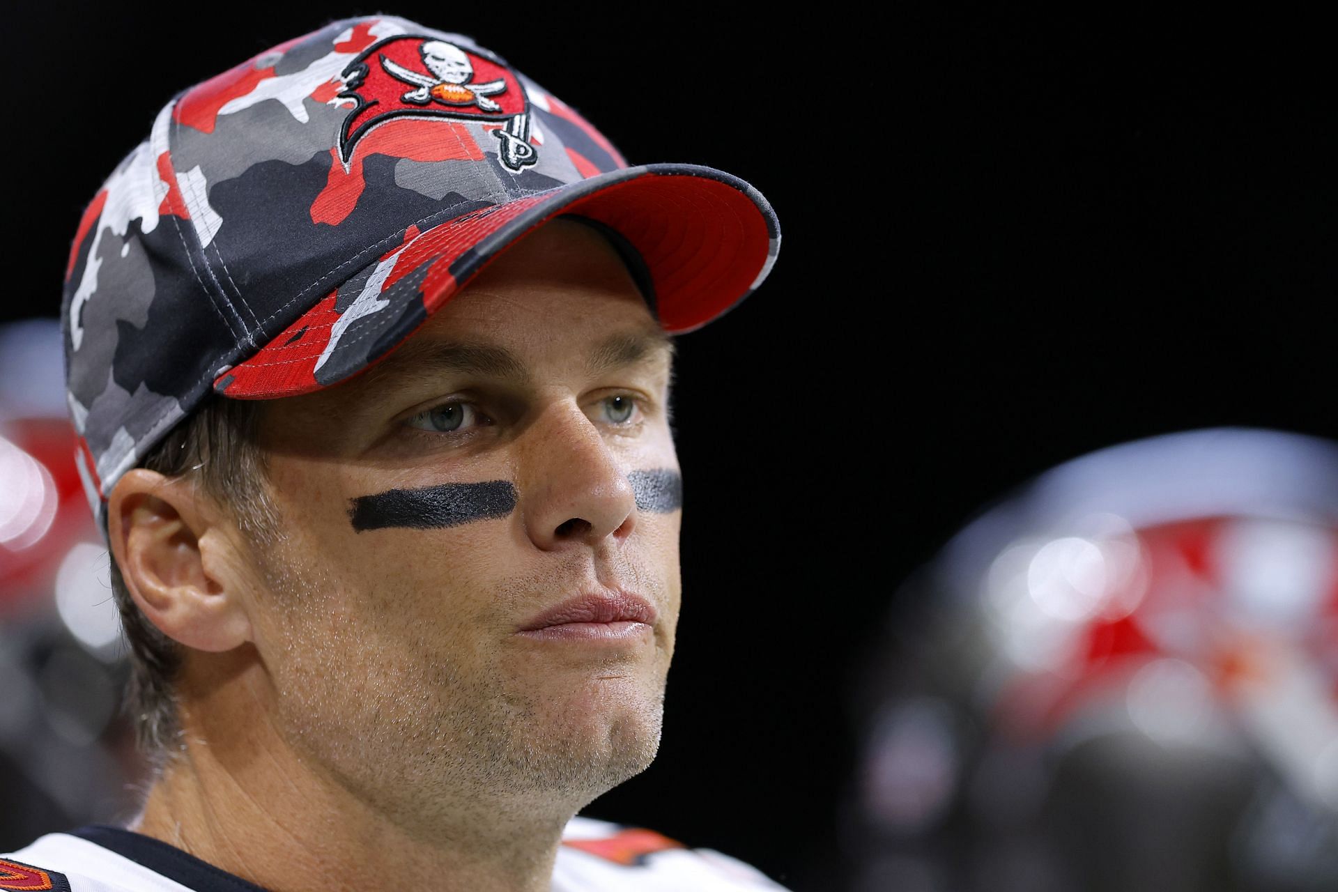 Tom Brady, #12 of the Tampa Bay Buccaneers, looks on from the tunnel before the game against the Atlanta Falcons at Mercedes-Benz Stadium on January 08, 2023, in Atlanta, Georgia.