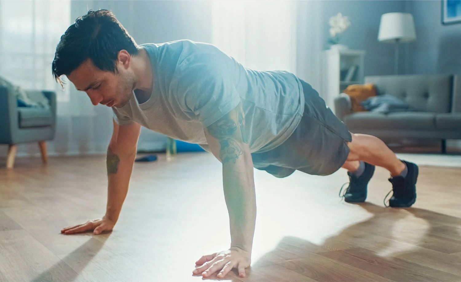 Push-ups in a workout (Image via Getty Images)