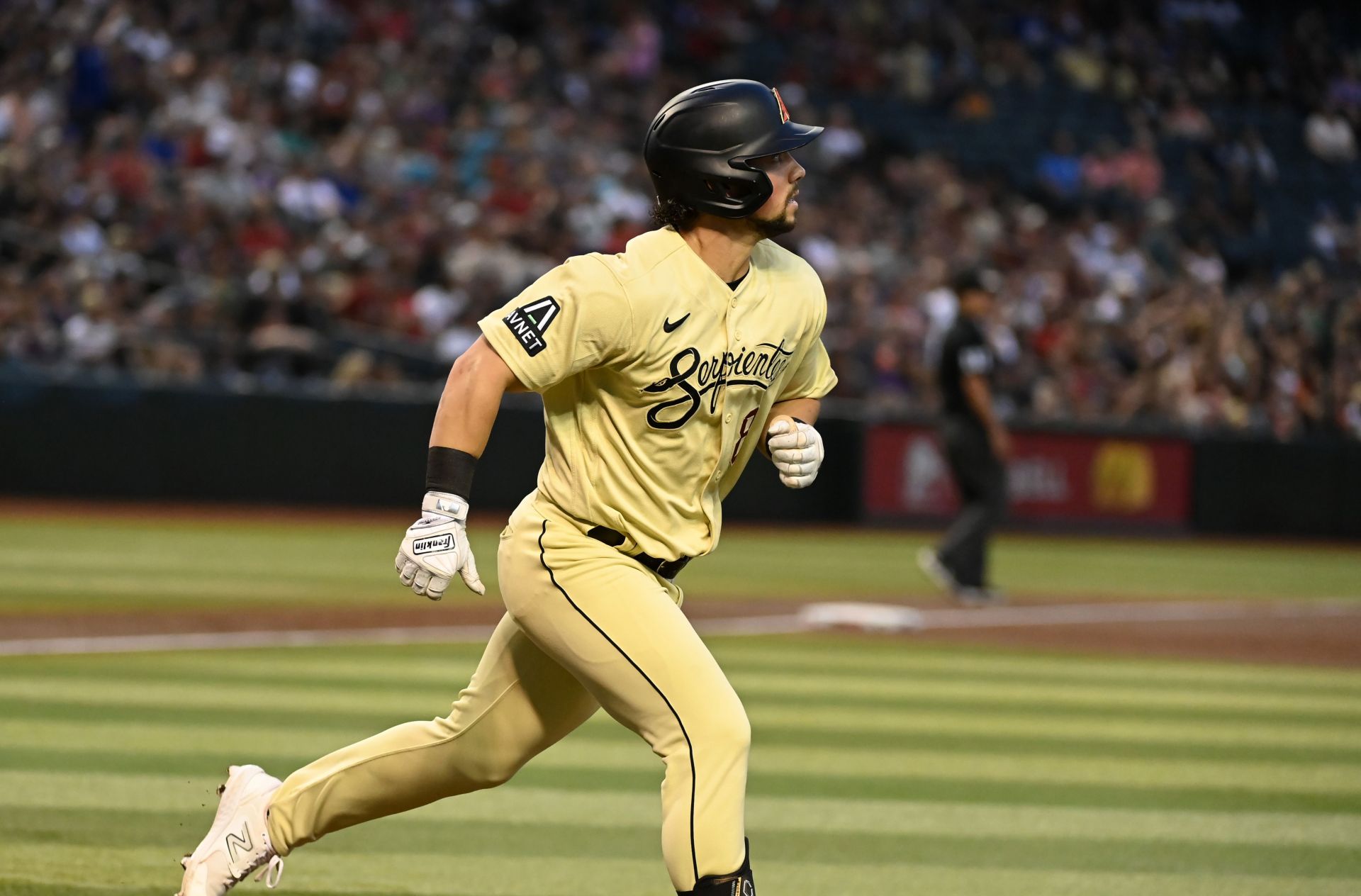 Dominic Fletcher of the Arizona Diamondbacks rounds the bases after hitting a three-run home run against the San Francisco Giants.