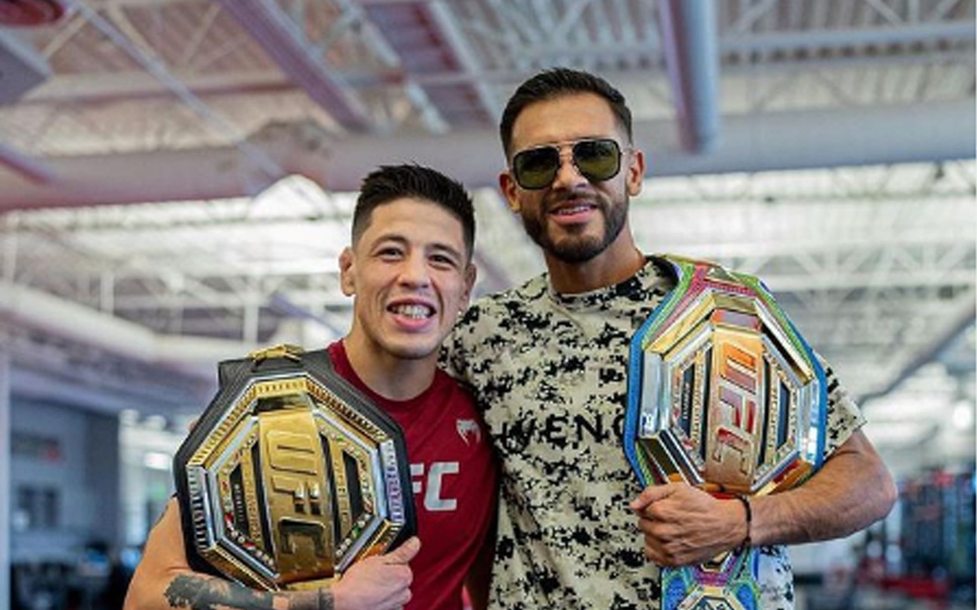 Yair Rodriguez (R) with fellow Mexican champion Brandon Moreno (L) (Image via @panteraufc Instagram)