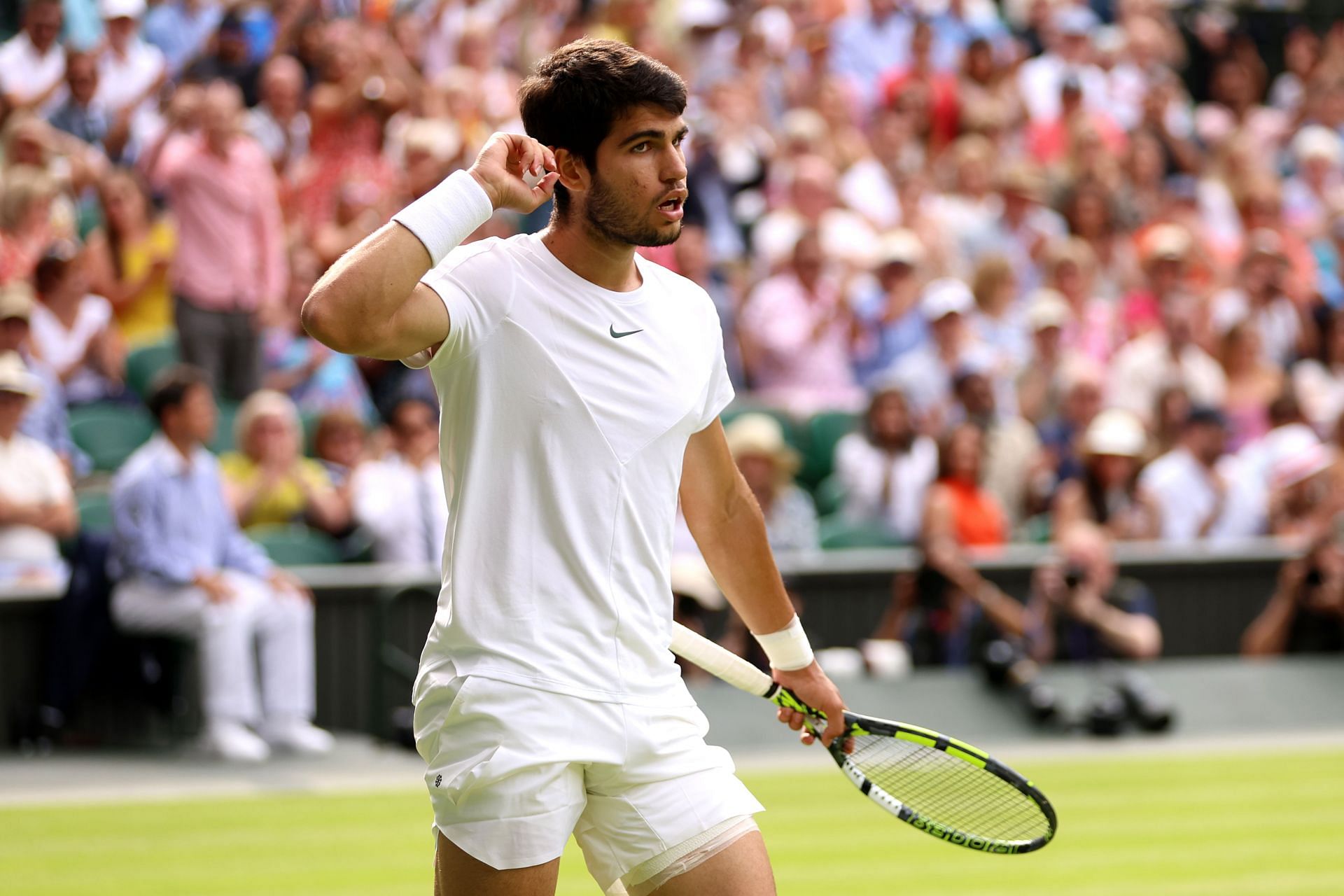 Alcaraz reacts after breaking Novak Djokovic&#039;s serve at Wimbledon