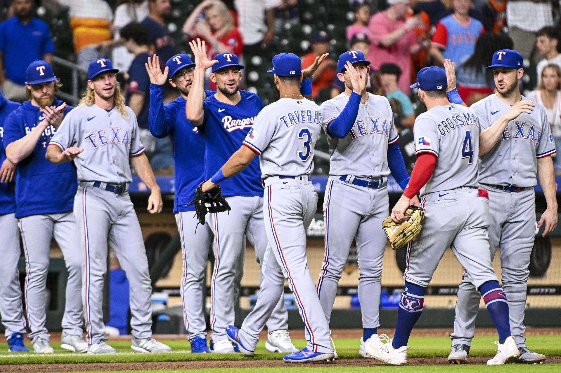 The Texas Rangers celebrate a victory over the Houston Astros at Minute Maid Park on July 26, 2023 in Houston, Texas. (Photo by Logan Riely/Getty Images)