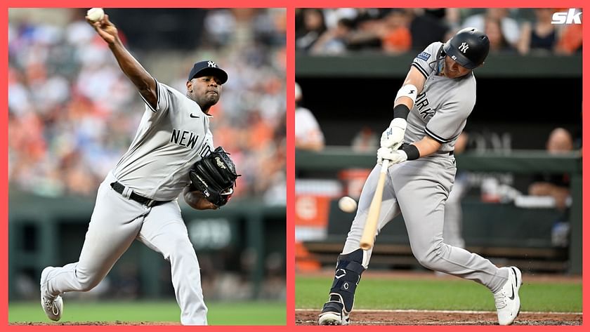 New York Yankee fans react when the Baltimore Orioles score is posted on  the big screen revealing that the Yankees win the MLB American League East  Division in the seventh inning against