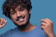 Regular flossing (Image via Freepik/Zinkevyh))
