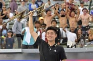 Yibing Wu lifts the Ultimate Tennis Showdown trophy in Los Angeles.
